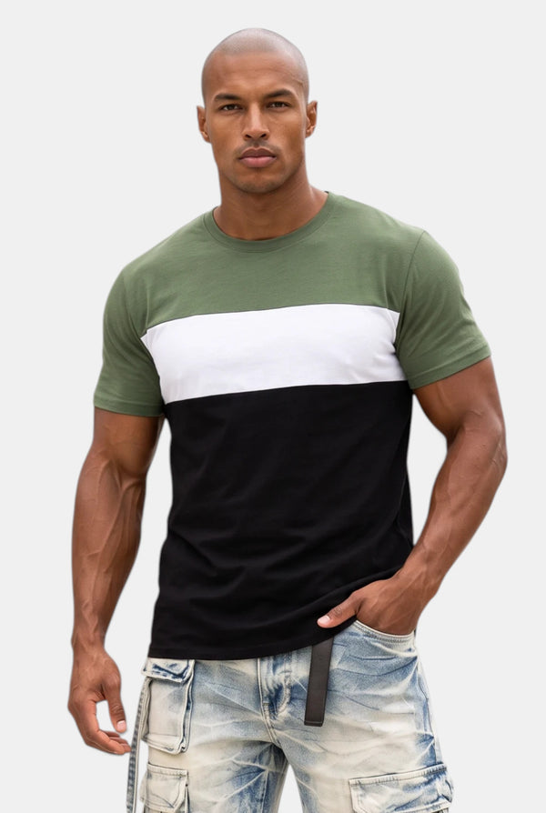 KIOKO Eastside colorblock t-shirt in olive, white, and black worn by a muscular man with light wash denim jeans