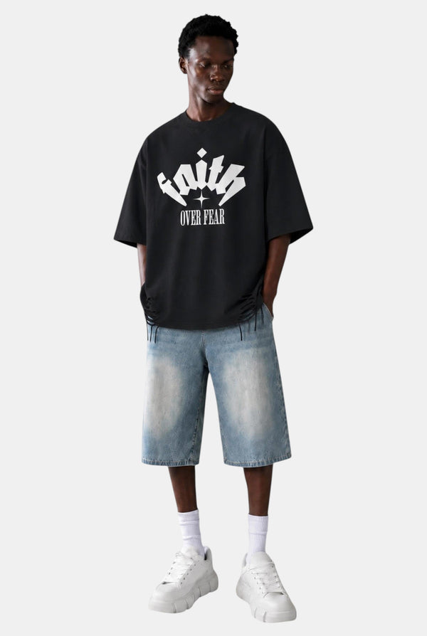 KIOKO black heavyweight cotton streetwear t-shirt with Faith Over Fear graphic, drop shoulders, and raw hem details.