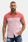 KIOKO Cityboy colorblock short-sleeve shirt in two-tone pink worn by a man with a beard against a white background.