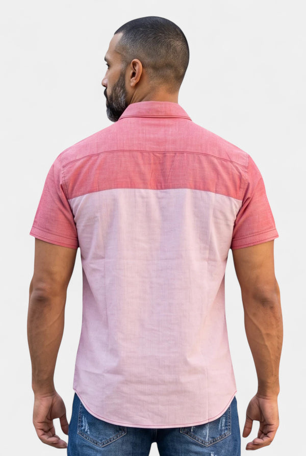 Back view of a man wearing a KIOKO Cityboy short-sleeve colorblock shirt in two-tone pink cotton blend