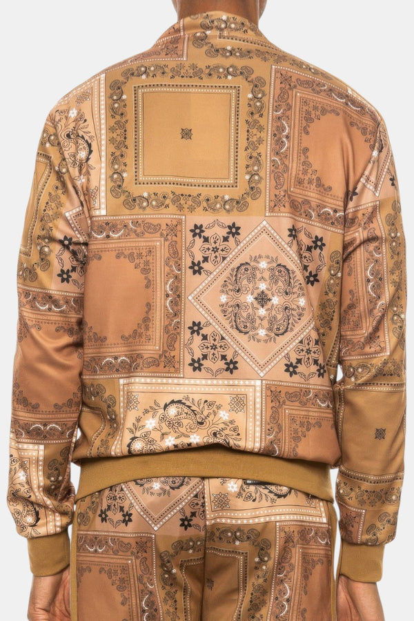 Back view of a KIOKO Crenshaw Paisley Bandana Track Jacket in khaki with an all-over intricate paisley print.
