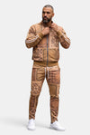 KIOKO Crenshaw paisley bandana track jacket in khaki with matching joggers worn by a man on a white background