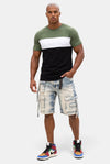 KIOKO Eastside colorblock t-shirt in olive, white, and black worn by a model with denim cargo shorts and sneakers.