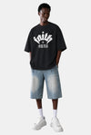 KIOKO black heavyweight cotton streetwear t-shirt with Faith Over Fear graphic, drop shoulders, and raw hem details.