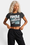 KIOKO Hustle Culture crop top in washed charcoal grey cotton, back view on a blonde model with black sweatpants.