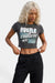 KIOKO Hustle Culture crop top in washed charcoal cotton with short sleeves and graphic print on a blonde model