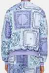 Back view of KIOKO lavender paisley bandana print crewneck sweatshirt with ribbed cuffs and cotton blend fabric.